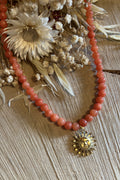 Collier perles orange & son soleil visage