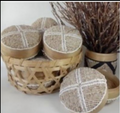 Round beaded brown box with a white cross