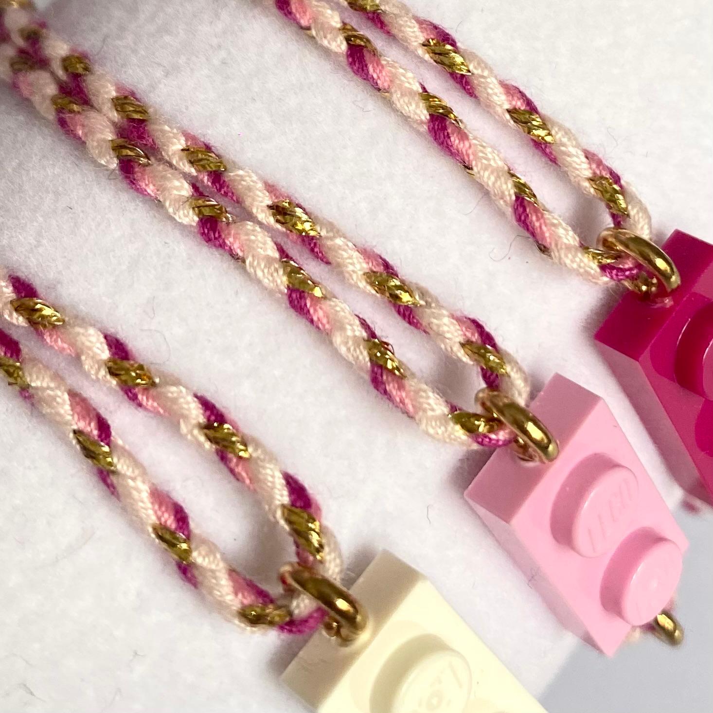 Bracelet ajustable cordon tressé rose dégradé