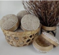 Round beige box with white stripes