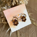 Creole earrings & their brown-beige flowers
