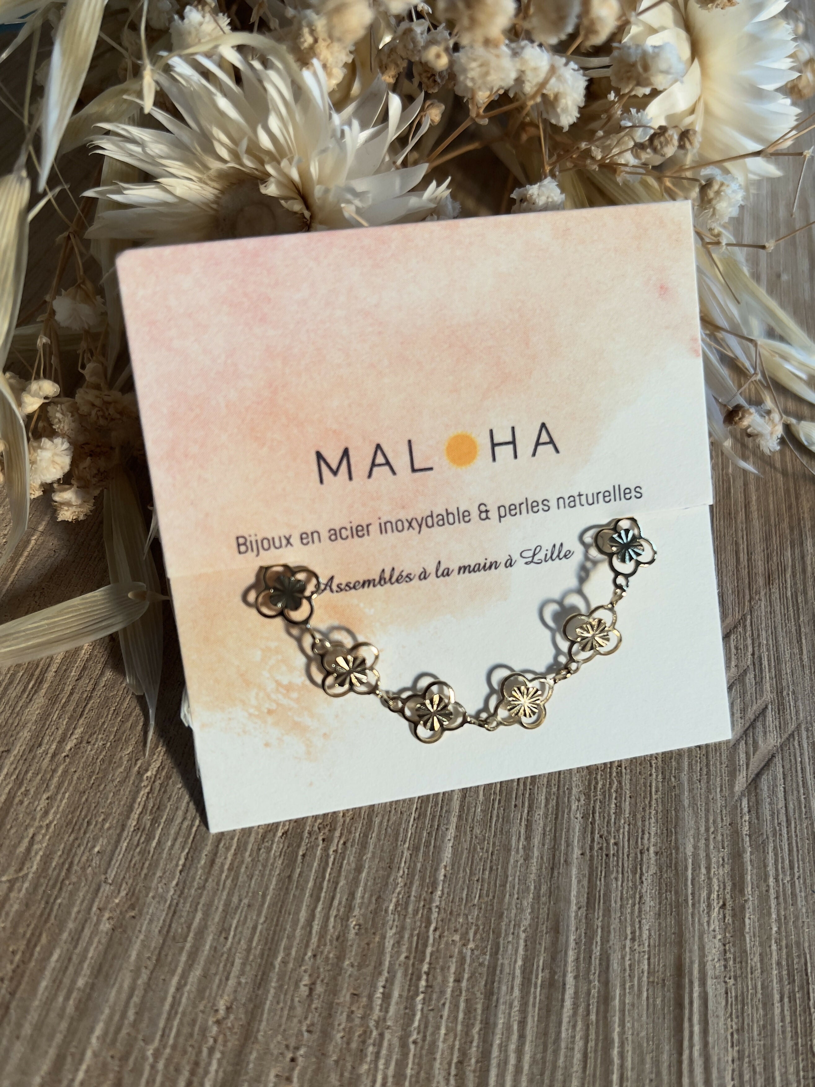 Bracelet fleurs/soleil doré inox